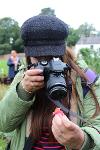 Photographer with camera close to her face