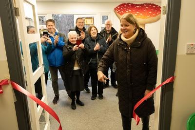 Woman cutting ribbon for Look exhibition