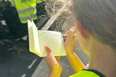 Child drawing outside